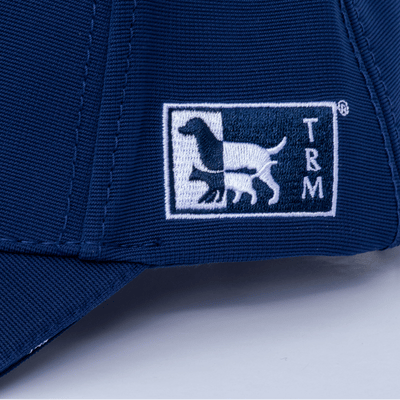 Close-up of TRM Pet Nutrition logo embroidery on cap